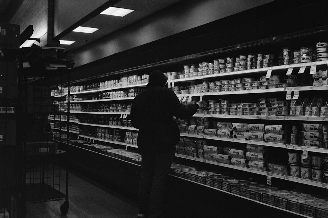 store detective chasing shoplifter